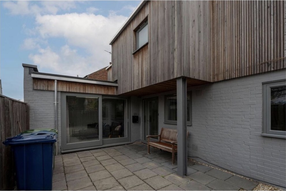The enclosed paved patio with sliding doors